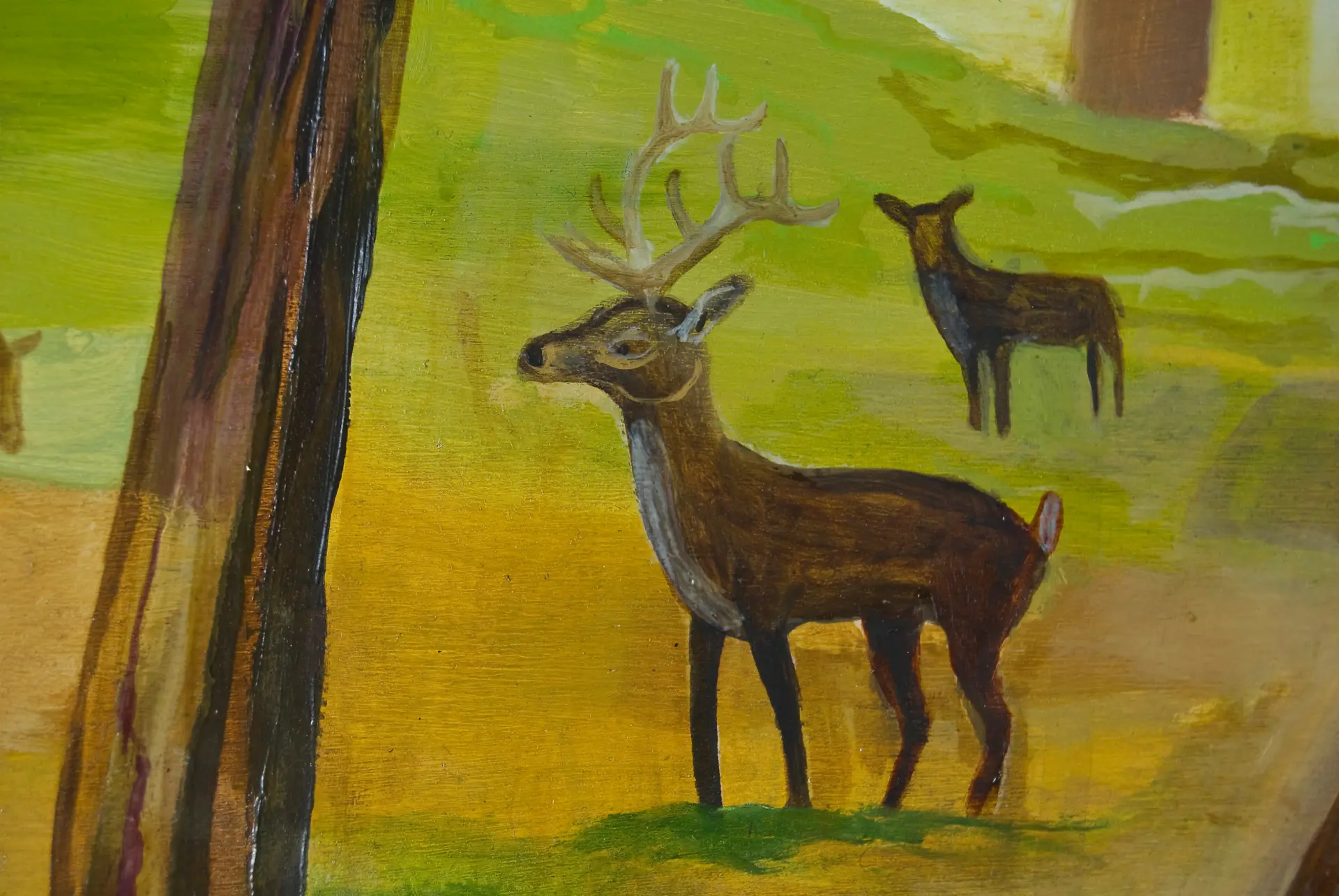 Painting of a deer with antlers and another deer in a green field